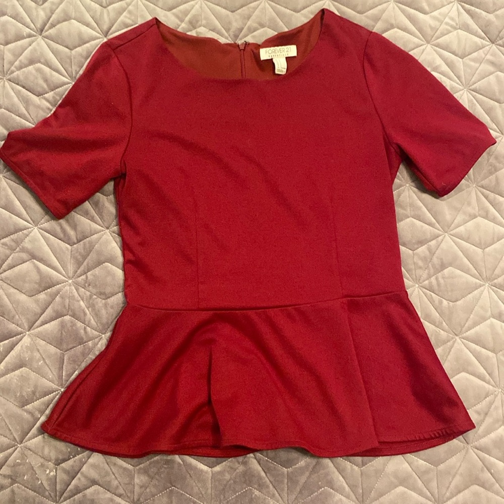 Wine colored peplum top with back zipper, size L